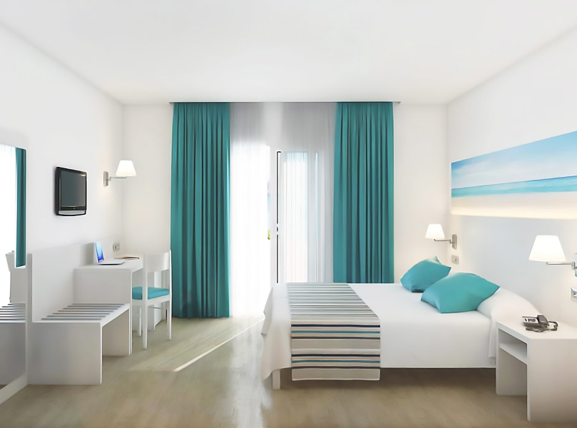 Habitación Confort_General Amplia y luminosa habitación con mobiliario blanco y textiles en tonos azules.